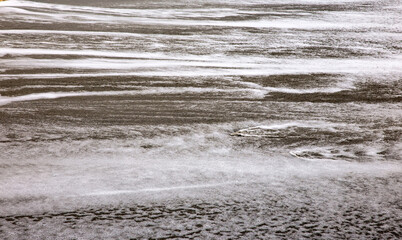 Water marks left on the beach after waves hit