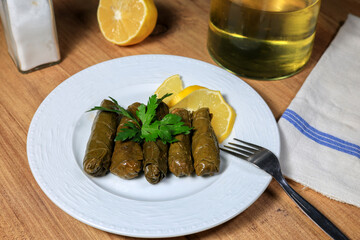 Delicious yaprak dolma (sarma) stuffed grape leaves rice. Lebanese dolma sarma on plate