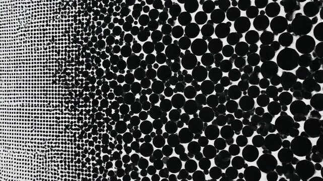 Abstract pattern of black dots on white background subtle gradient effect