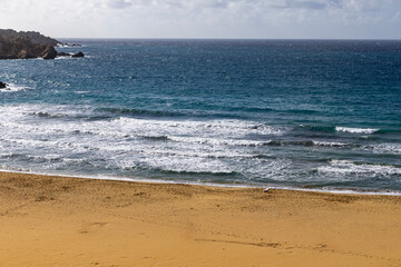Golden Bay, Malta. A yellow-sand beach on the Mediterranean Sea.