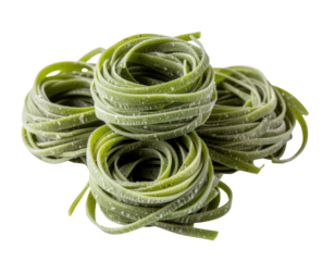 Three coiled nests of uncooked, flat green tagliatelle pasta, lightly dusted with flour.