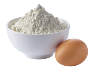 A white bowl filled with a heap of flour next to a single brown egg.