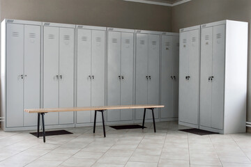 dressing room with metal drawers and benches
