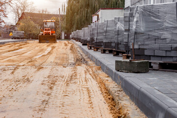repair of the road with the help of concrete paving slabs