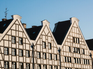Facades of houses in Gdansk. Three houses against sky