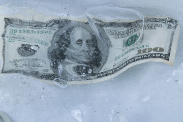 One Hundred Dollar Bill Frozen in Ice Block