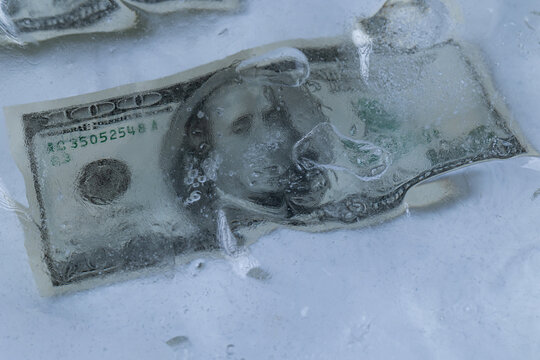 One Hundred Dollar Bill Frozen in Ice Block
