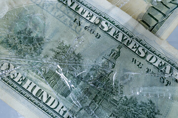 One Hundred Dollar Bill Frozen Under Ice