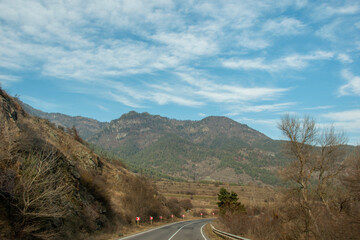 deserted mountain road through the mountains. Autumn.