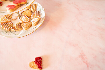 Valentines  heart shapped  cookies  in top left  corner  and  one  on the  bottom   romantic  weeding  favours 