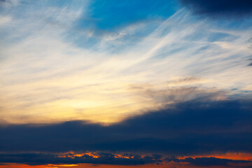 Blue sky filled with fluffy clouds, soft shapes drifting across open sky, calm atmosphere and gentle light, peaceful weather scene, nature background, relaxation and mindfulness concept