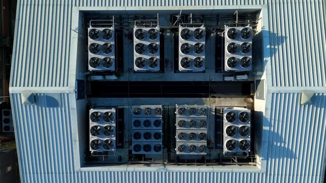 Aerial view of the Six Degrees data centre showcases the roof's array of cooling systems, gleaming under the sunlight, Redditch, United Kingdom.