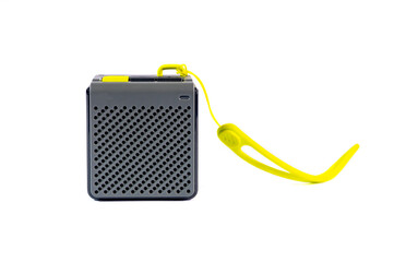 Wireless music speaker isolated on white. A modern grey audio gadget with yellow details, perfect for technology and entertainment concepts.