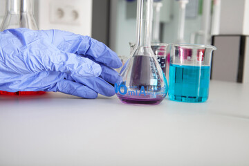 A doctor conducting research with plastic medical tubes in a modern laboratory.