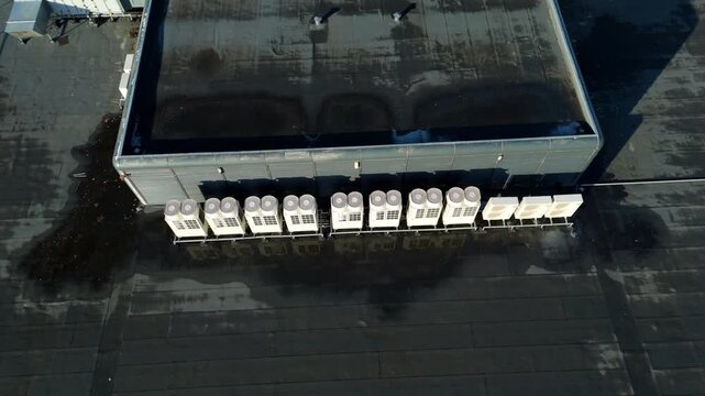 Aerial view of the IBM Data Centre roof featuring rows of cooling units against the flat, dark roofing, Royal Leamington Spa, United Kingdom.