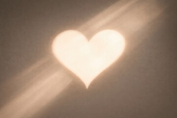A heart of light and shadow on a flat surface. Love concept and Valentine's Day greetings for social media