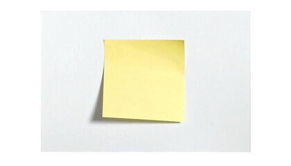 A square yellow sticky note affixed to a white rectangular surface, creating a visual contrast