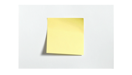 A square yellow sticky note affixed to a white rectangular surface, creating a visual contrast