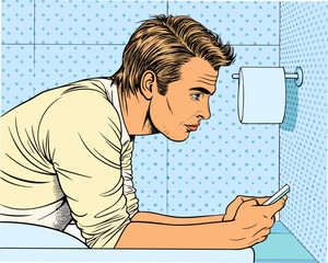 Man checking phone in bathroom with toilet paper roll nearby