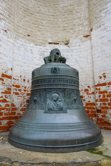 Fototapeta premium Unique historical bell in Pereslavl-Zalessky surrounded by ancient bricks