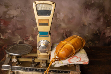 Provolone cheese, wonderful smoked provolone cheese on rustic wood and accessories, abstract background, selective focus.