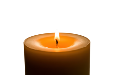 Burning candle with warm glow