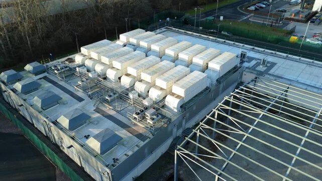 Birmingham, United Kingdom - 31 December 2025: Aerial view of the ATOS Data Centre long bridge, showcasing its rooftop infrastructure and surrounding landscape.