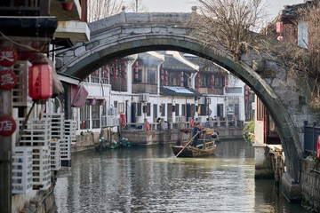 Ornate two-tiered pavilion with upturned eaves and red decorative lanterns