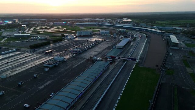 Towcester, United Kingdom - 20 December 2025: Aerial view of Silverstone Circuit, a symphony of asphalt and steel under the soft glow of the setting sun.