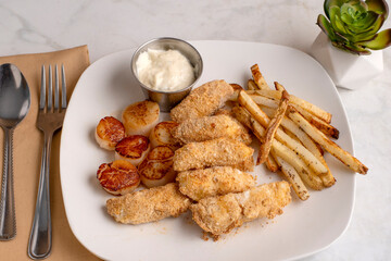 haddock bite with pan sheared scallops and  fries