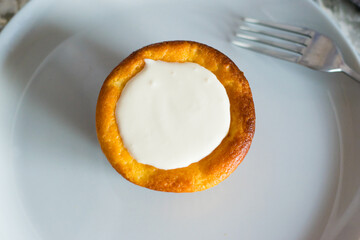 Delicious cheesecake with sour cream on a plate. Breakfast concept for the family