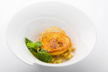 Gourmet custard tart with spun sugar and mint © EdienuFoto