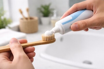 Essential Oral Hygiene Routine: Applying Toothpaste on a Natural Bamboo Toothbrush in a Bright Bathroom Setting