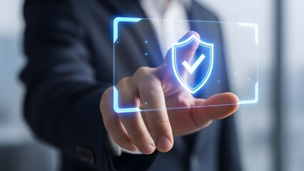 Businessman interacting with a digital shield icon for cybersecurity