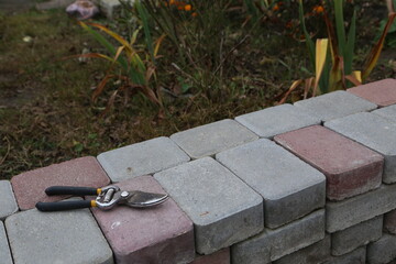 garden tool on wall during daytime in outdoor space