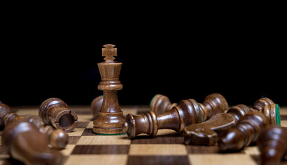 Black King chess piece standing strong 