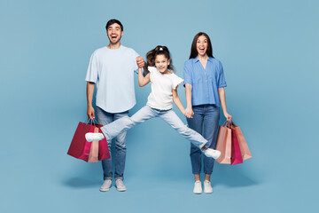 Full body young excited overjoyed parents mom dad with child kid daughter girl wear casual clothes...