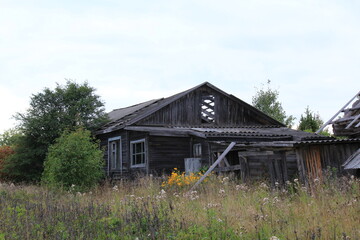 Abandoned, uninhabited houses in old villages from the time of collective farms and collectivization in the Soviet Union. 1930-1940-1950s, Sloboda village, north of the Kirov region, Russia.