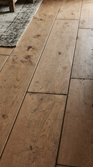  A vertical close-up of a rustic wooden floor with a matte finish and deep grooves between the planks. The texture of the wood is emphasized by soft ambient lighting, revealing its rough, handcrafted 