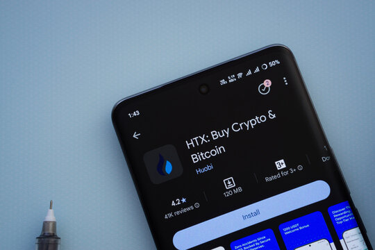 Dhaka, Bangladesh- 29 May 2025: On a blue surface, a smartphone displays the HTX app within the Google Play Store.