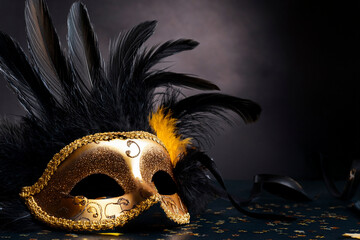 Carnival celebration with people in colorful masks and festive costumes