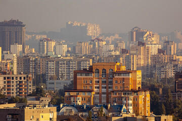 Kyiv, Ukraine, Podil center, historical and modern residential architecture at morning sunrise. Cityscape with neoclassical facades, urban skyline and morning golden hour light in capital. © Sodel Vladyslav