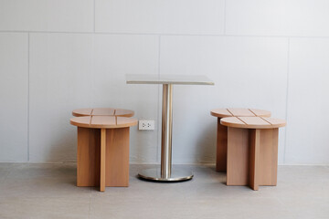 A modern-designed wooden table and chair set.