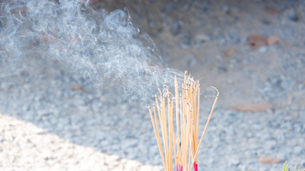 Smoke rises from the incense that is lit to worship sacred beings and make a wish.