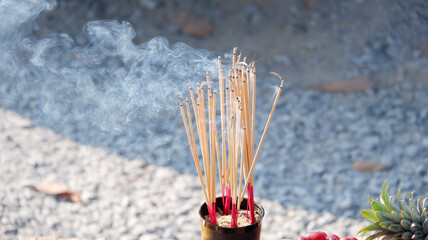 Smoke rises from the incense that is lit to worship sacred beings and make a wish.