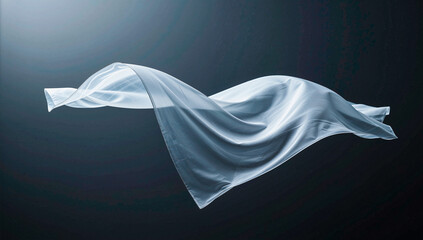White Fabric Sheet Floating in Dark Studio Lighting