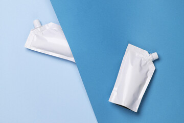 White Doypacks on blue background