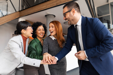 Group of Diverse Business Professionals Engaging in Teamwork and Collaboration Indoors