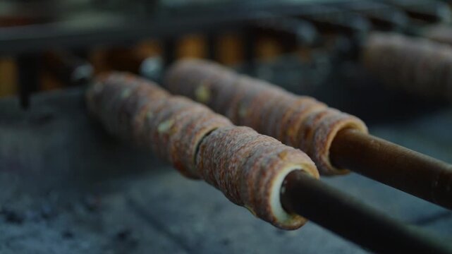 Traditional Czech trdelnik pastry cooking in Prague.