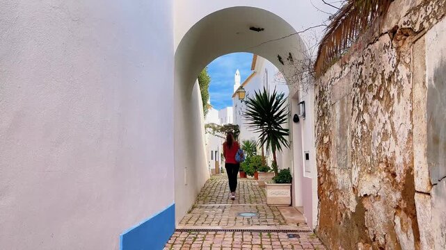 woman traveling on the street in the old town of Albufeira in Portugal